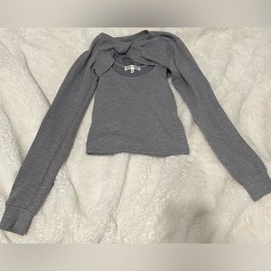 Gray tank top with long sleeve 2nd layer, never worn,comfortable,and size small.